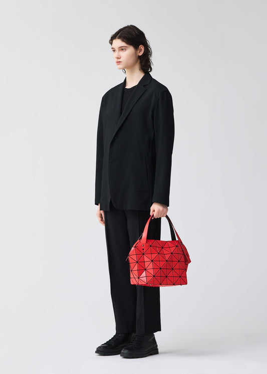 A model wears the BAO BAO ISSEY MIYAKE BOSTON hand bag.