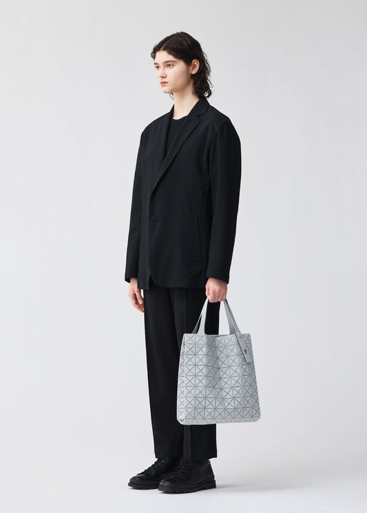 A model wears the BAO BAO ISSEY MIYAKE PRISM PLUS tote.