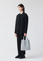 A model wears the BAO BAO ISSEY MIYAKE PRISM PLUS tote.