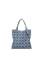 A product shot of the BAO BAO ISSEY MIYAKE PRISM DENIM tote in blue.