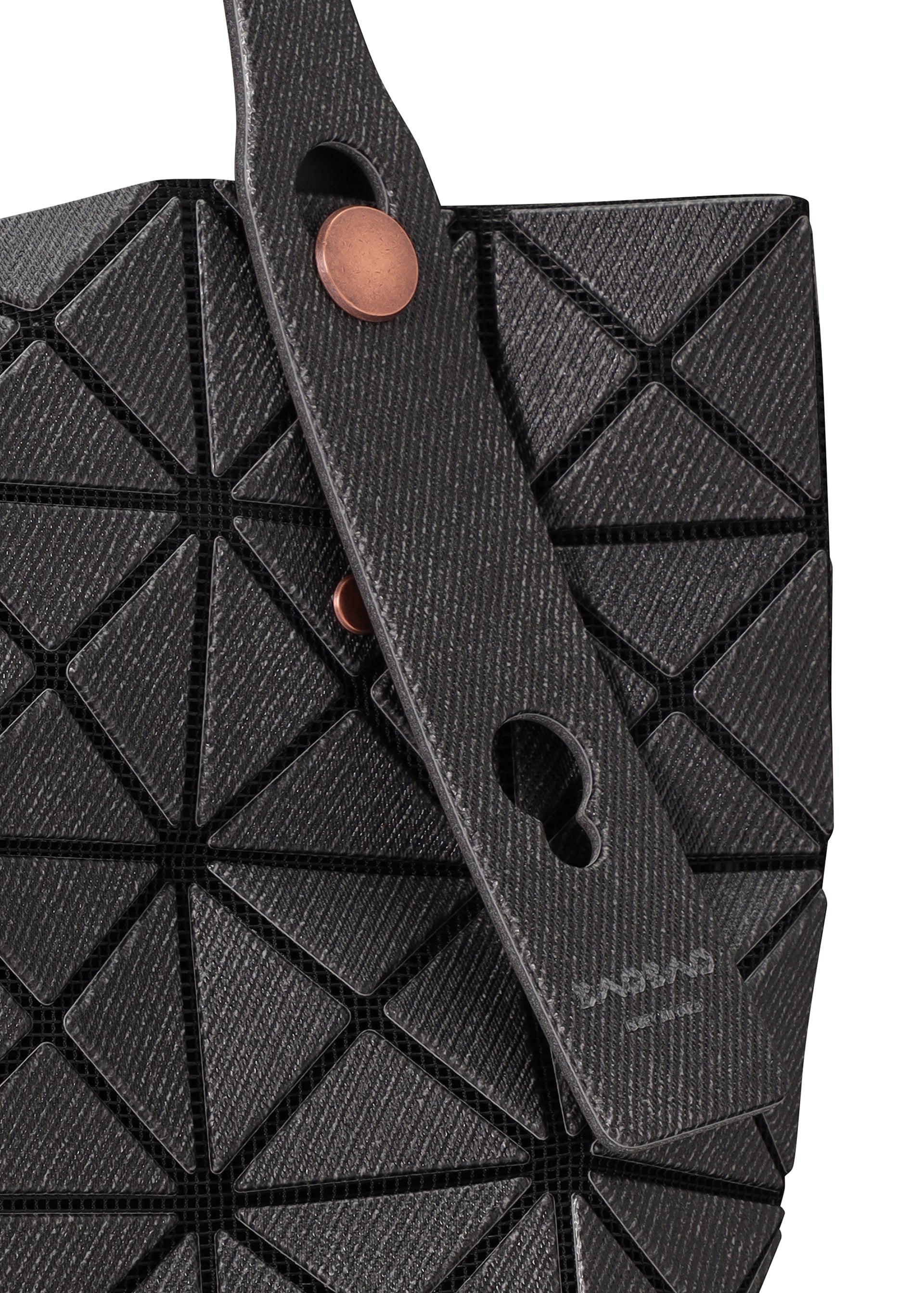 A detail shot of the BAO BAO ISSEY MIYAKE PRISM DENIM tote.