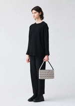 A model wears the BAO BAO ISSEY MIYAKE OBLONG oblong-shoulder-bag-khaki-1.