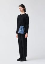 A model wears the BAO BAO ISSEY MIYAKE WRING DENIM wring-denim-shoulder-bag-black.