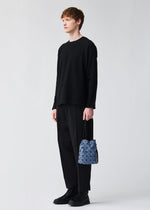 A model wears the BAO BAO ISSEY MIYAKE WRING DENIM wring-denim-shoulder-bag-blue.