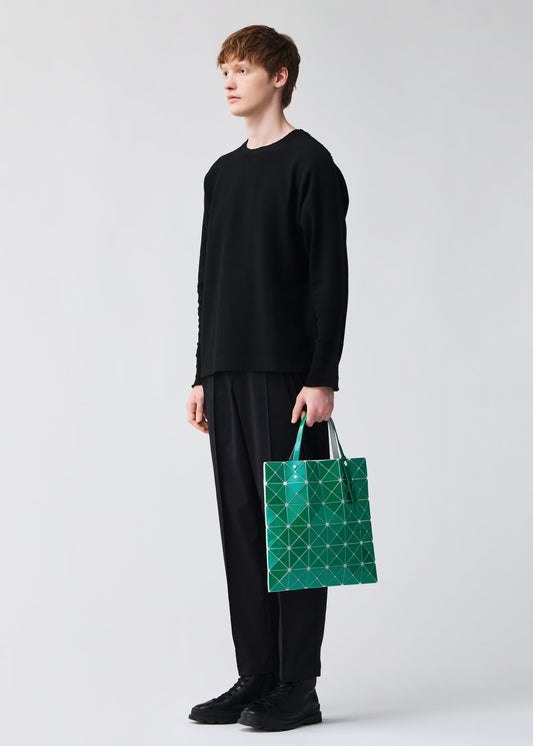 A model wears the BAO BAO ISSEY MIYAKE LUCENT METALLIC tote.