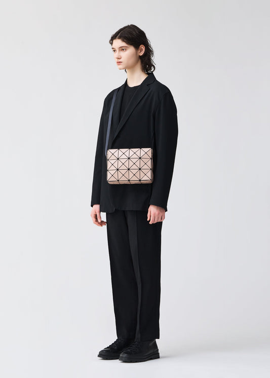 A model wears the BAO BAO ISSEY MIYAKE CUBOID shoulder bag.