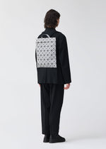 A model wears the BAO BAO ISSEY MIYAKE FLAT PACK backpack.