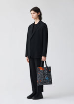 A model wears the BAO BAO ISSEY MIYAKE MAP tote.
