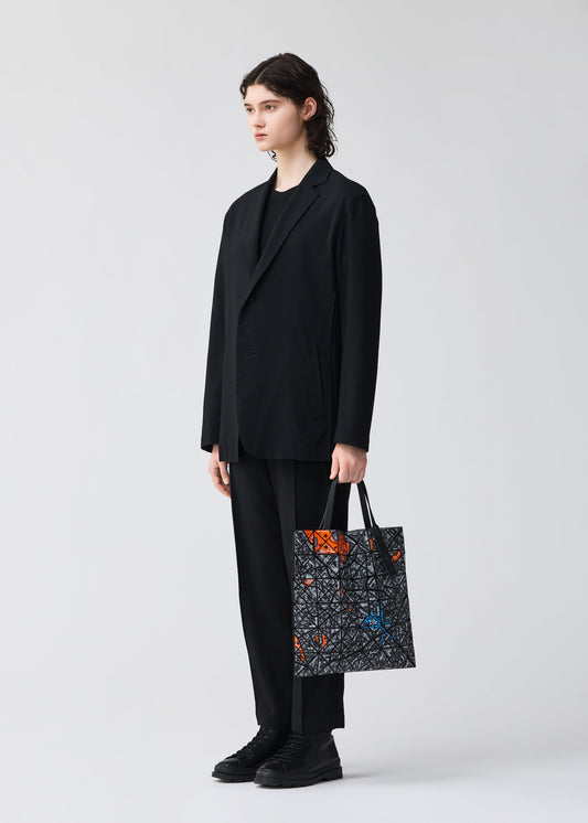 A model wears the BAO BAO ISSEY MIYAKE MAP tote.