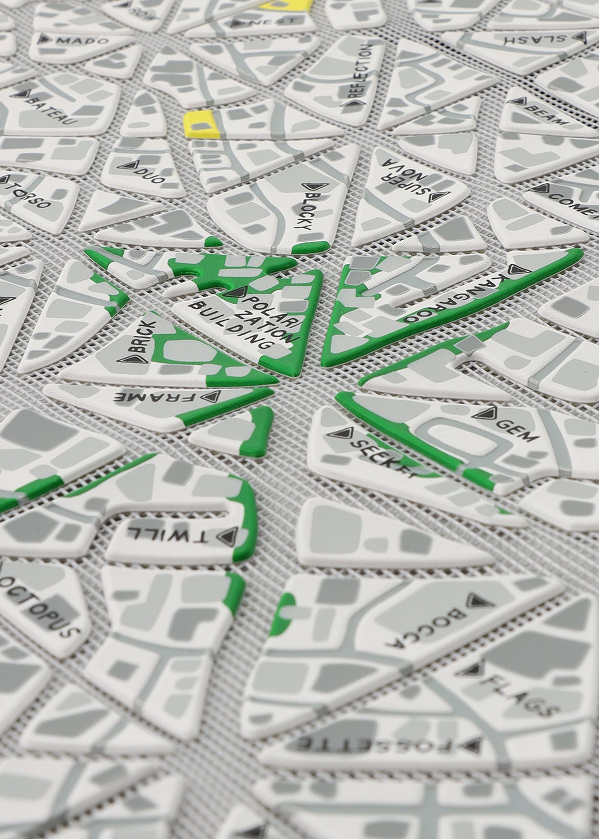 A detail shot of the BAO BAO ISSEY MIYAKE MAP tote.