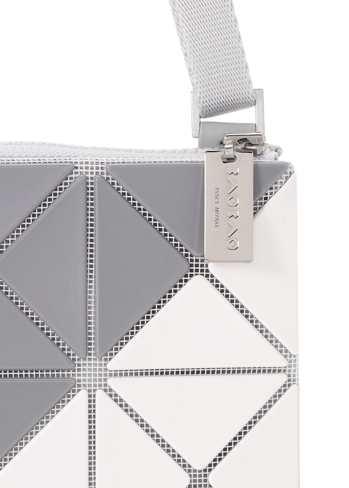 A detail shot of the BAO BAO ISSEY MIYAKE SIGN shoulder bag.