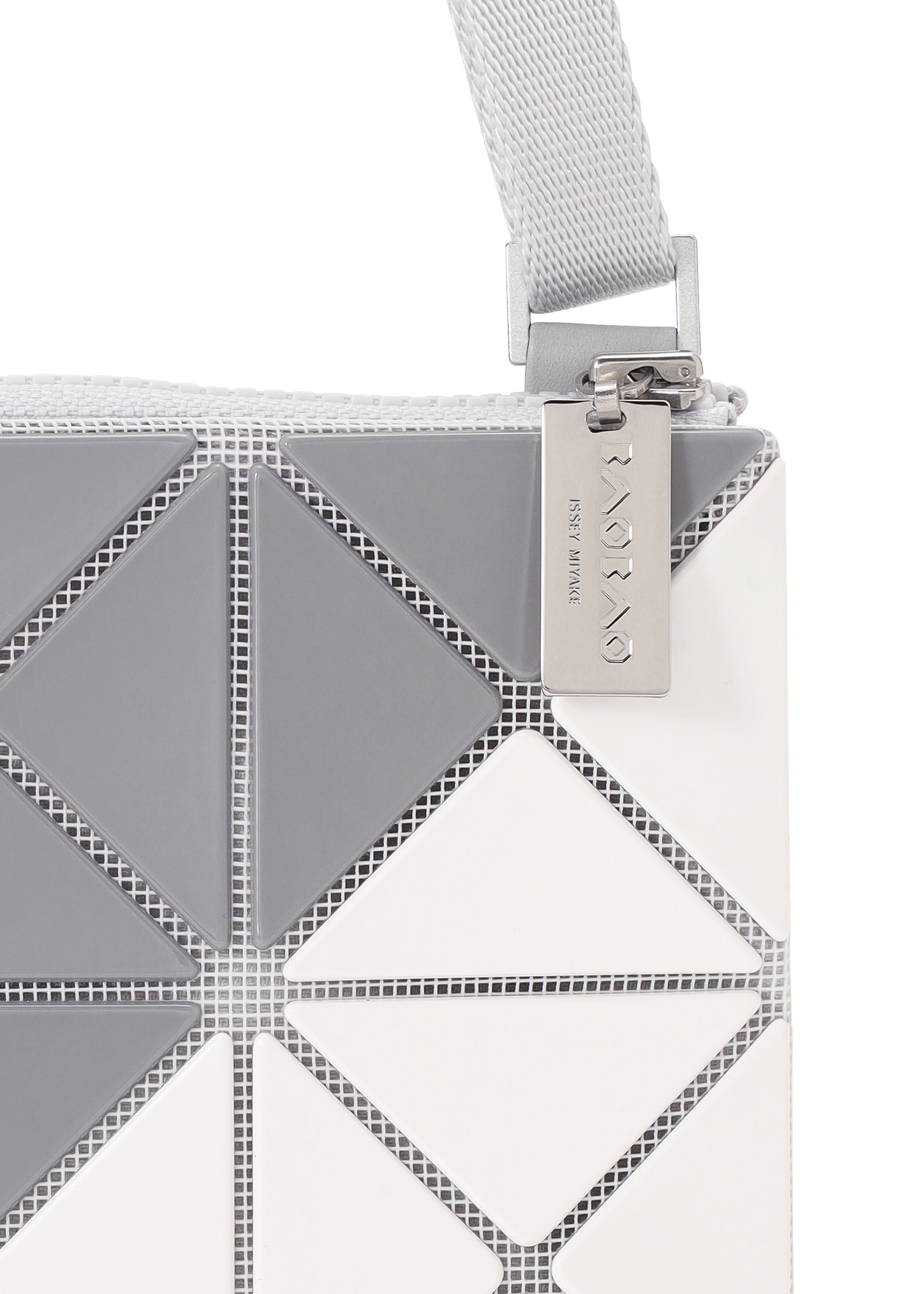 A detail shot of the BAO BAO ISSEY MIYAKE SIGN shoulder bag.