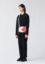 A model wears the BAO BAO ISSEY MIYAKE SIGN shoulder bag.