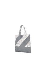 A detail shot of the BAO BAO ISSEY MIYAKE SIGN tote.