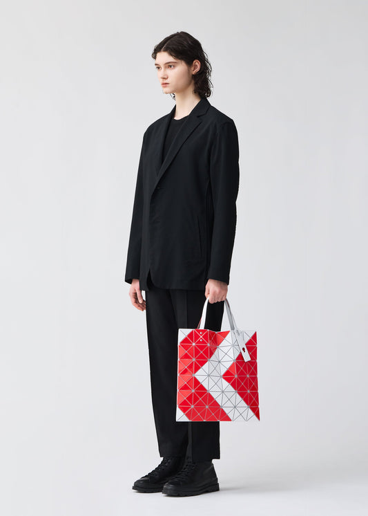 A model wears the BAO BAO ISSEY MIYAKE SIGN tote.