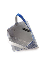 A detail shot of the BAO BAO ISSEY MIYAKE SIGN tote.