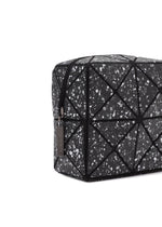 A detail shot of the BAO BAO ISSEY MIYAKE CITY pouch.