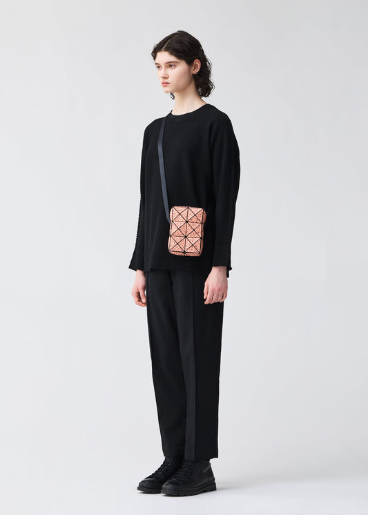A model wears the BAO BAO ISSEY MIYAKE CITY shoulder bag.