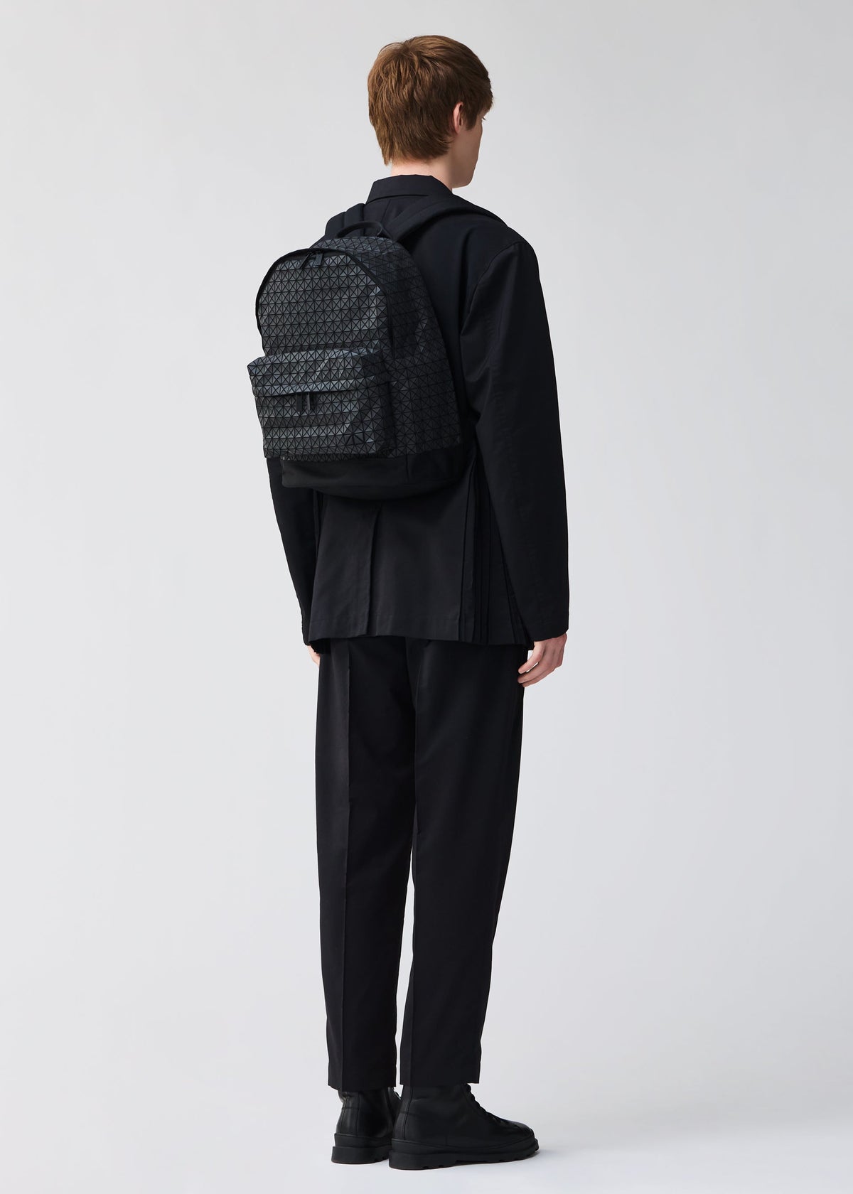 A model wears the BAO BAO ISSEY MIYAKE DAYPACK backpack.