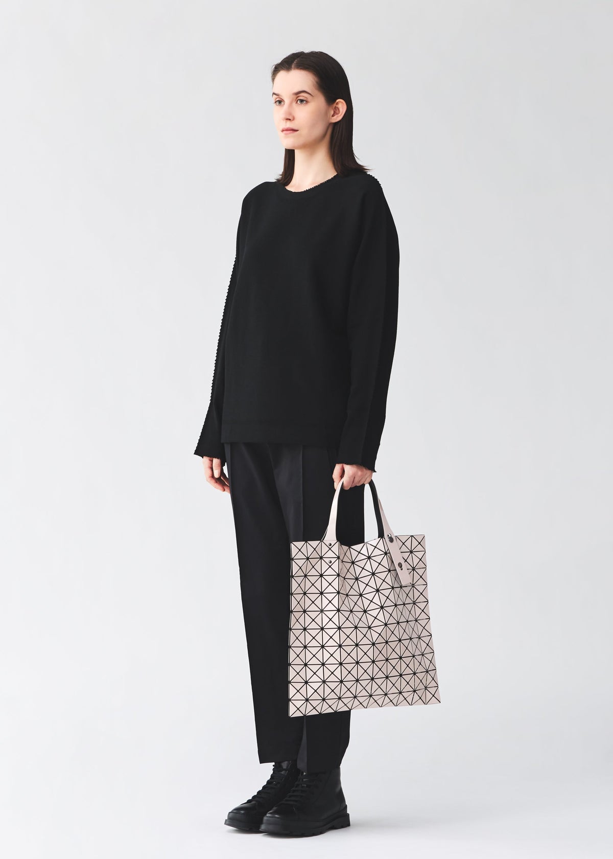 A model wears the BAO BAO ISSEY MIYAKE PRISM prism-tote-black-3.