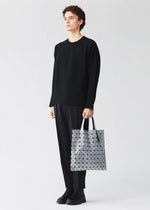 A model wears the BAO BAO ISSEY MIYAKE PRISM prism-tote-black-3.