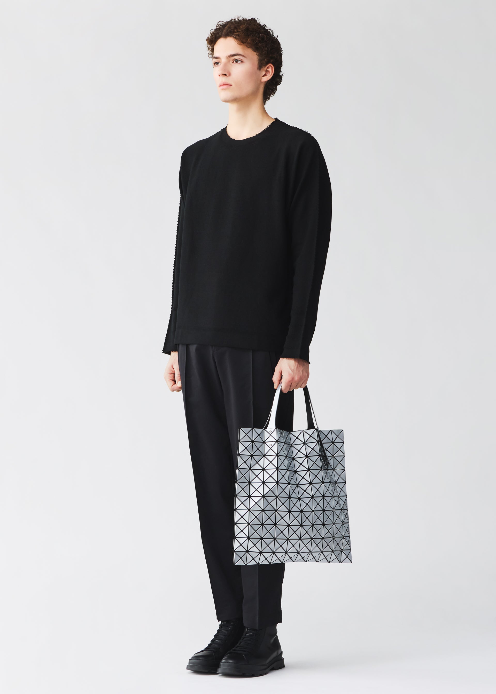 A model wears the BAO BAO ISSEY MIYAKE PRISM prism-tote-black-3.