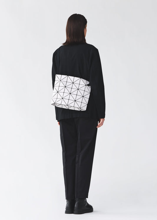A model wears the BAO BAO ISSEY MIYAKE BLOCKY blocky-adjustable-shoulder-bag-matte-black.