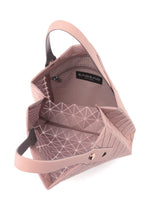 A detail shot of the BAO BAO ISSEY MIYAKE PRISM PLUS tote.