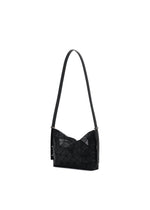 A detail shot of the BAO BAO ISSEY MIYAKE MUSETTE shoulder bag.