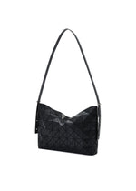 A detail shot of the BAO BAO ISSEY MIYAKE MUSETTE shoulder bag.