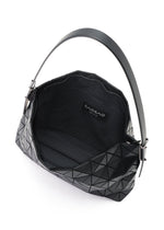 A detail shot of the BAO BAO ISSEY MIYAKE MUSETTE shoulder bag.
