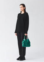 A model wears the BAO BAO ISSEY MIYAKE CARAT carat-handbag-sphene-yellow-1.
