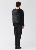 A model wears the BAO BAO ISSEY MIYAKE HIKER hiker-backpack-matte-black-3.
