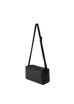 A detail shot of the BAO BAO ISSEY MIYAKE SADDLE BAG shoulder bag.
