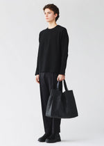 A model wears the BAO BAO ISSEY MIYAKE CART cart-tote-matte-black-3.