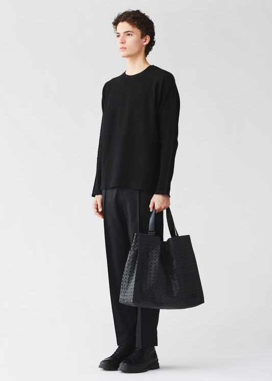 A model wears the BAO BAO ISSEY MIYAKE CART cart-tote-matte-black-3.