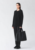 A model wears the BAO BAO ISSEY MIYAKE CART cart-tote-matte-black-3.