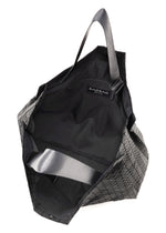 A detail shot of the BAO BAO ISSEY MIYAKE CART tote.