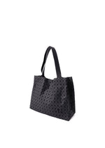 A detail shot of the BAO BAO ISSEY MIYAKE CART MINI tote.