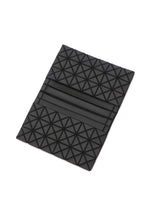 A detail shot of the BAO BAO ISSEY MIYAKE OYSTER accessory.