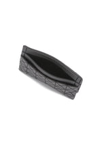 A detail shot of the BAO BAO ISSEY MIYAKE OYSTER accessory.