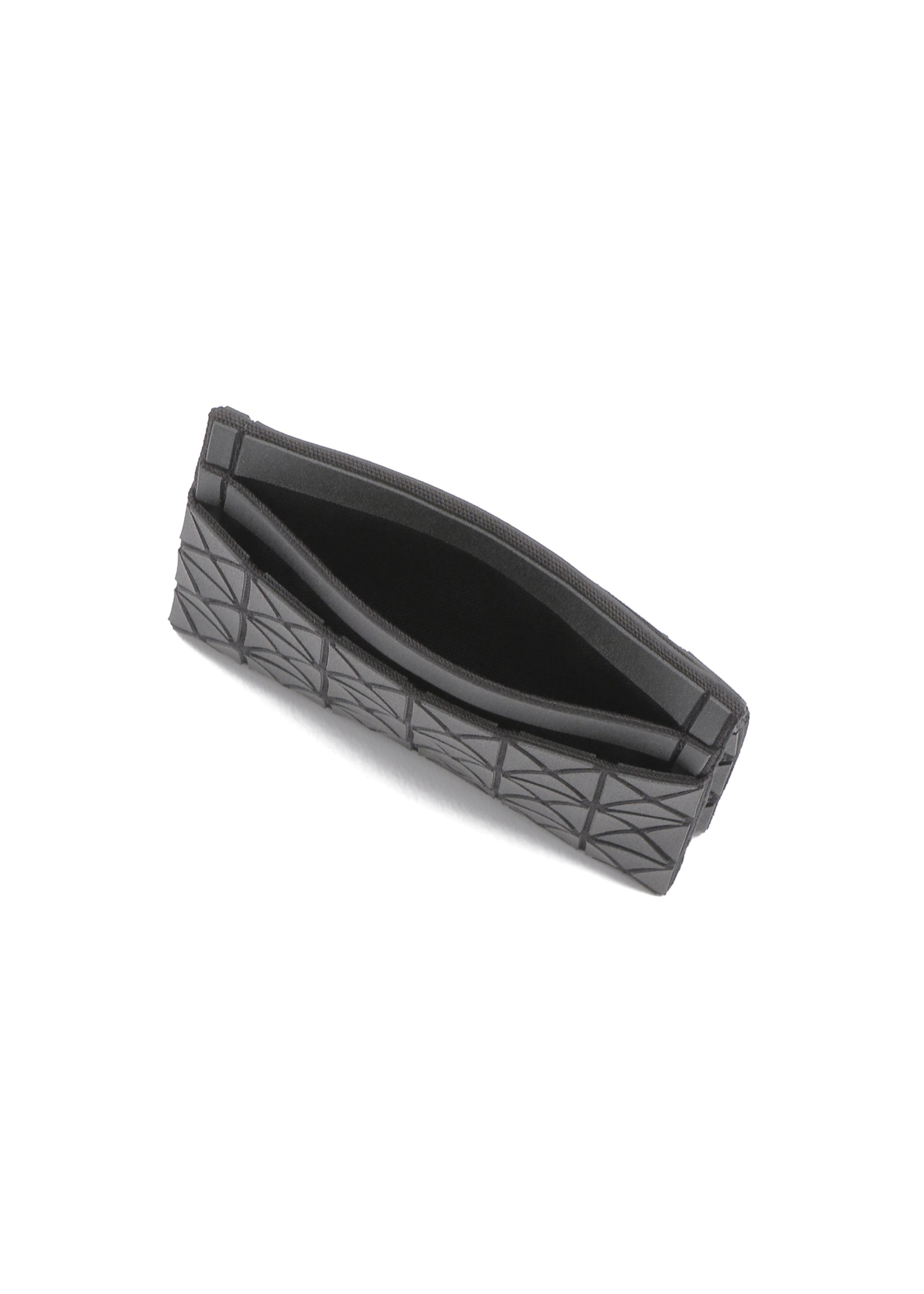 A detail shot of the BAO BAO ISSEY MIYAKE OYSTER accessory.