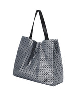 A detail shot of the BAO BAO ISSEY MIYAKE CART REFLECTOR tote.