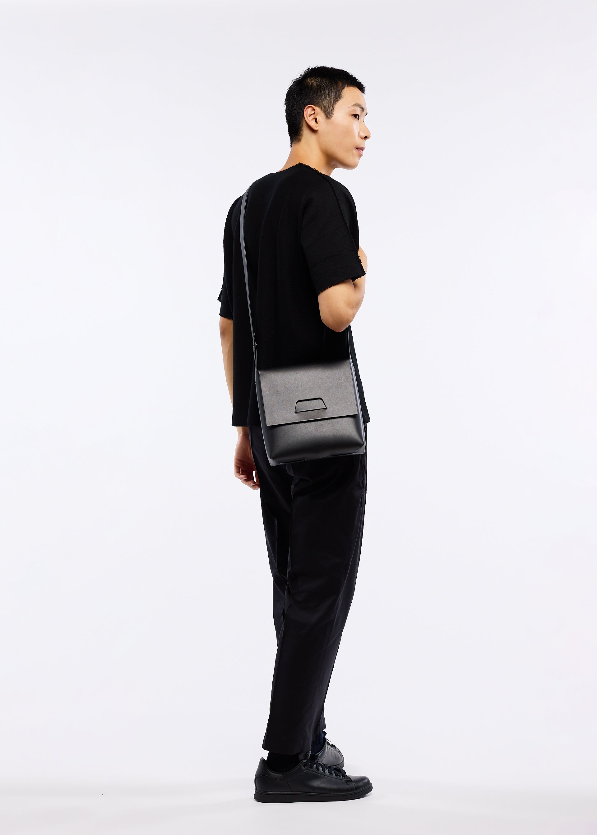 A model wears the GOOD GOODS ISSEY MIYAKE BOX bag.