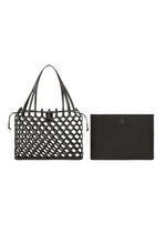 A detail shot of the GOOD GOODS ISSEY MIYAKE AMIME bag.