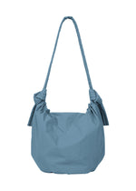 A detail shot of the GOOD GOODS ISSEY MIYAKE FUWA FUWA bag.