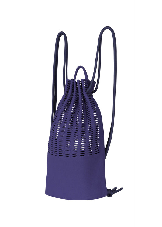 A product shot of the GOOD GOODS ISSEY MIYAKE MOKKO KNAPSACK bag in blue purple.