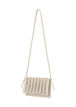 A detail shot of the GOOD GOODS ISSEY MIYAKE MOKKO TWILL bag.