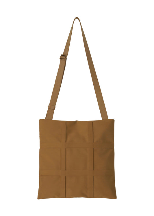 A product shot of the GOOD GOODS ISSEY MIYAKE GRID bag in brown (44).