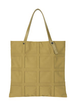 A product shot of the GOOD GOODS ISSEY MIYAKE GRID bag in dark yellow (53).